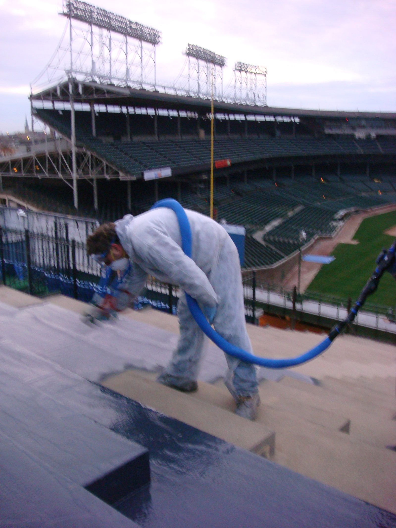 Polyurea floor coating installation with decorative flake broadcast